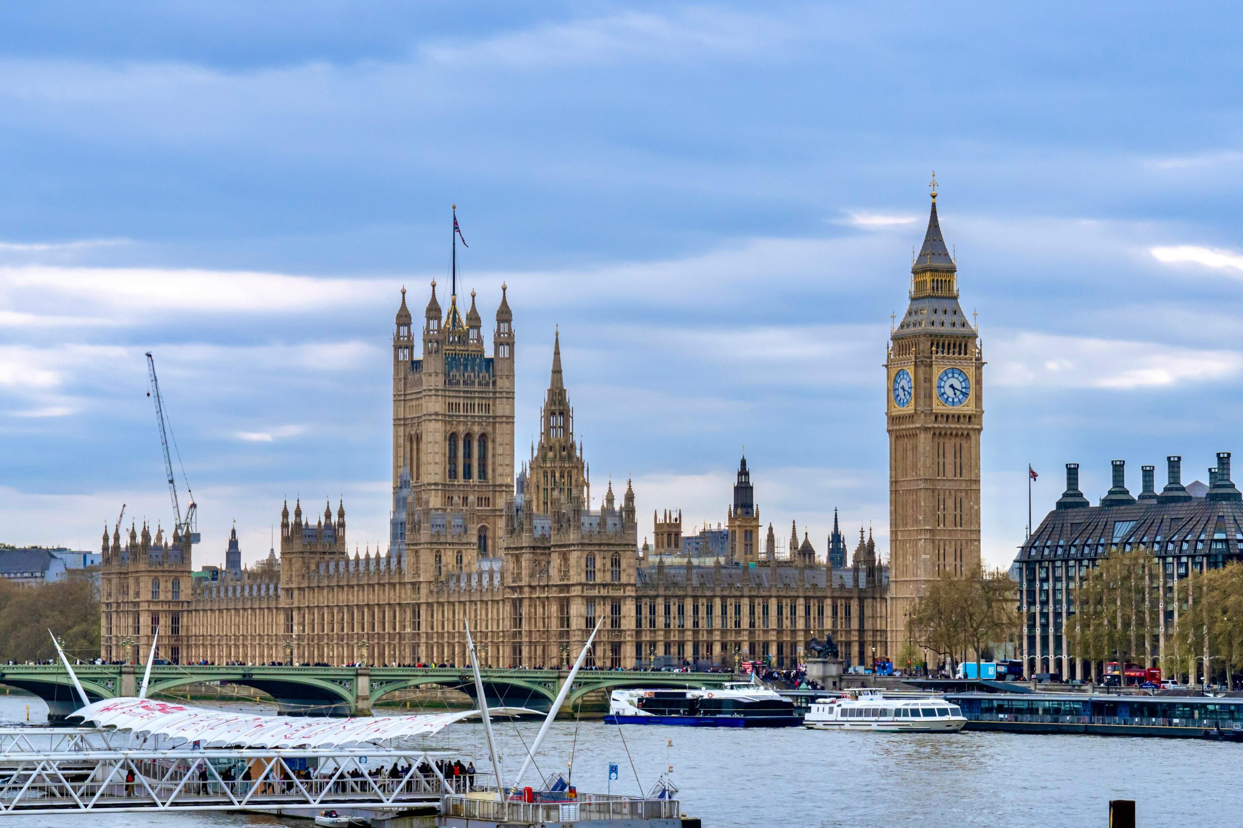 Stunning view of Big Ben and the Houses of Parliament along the River Thames in London, England.